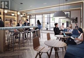 Toronto (South Riverdale) condo for rent - A modern interior of a cafe with people sitting and standing around.