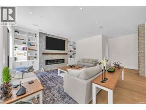 West Vancouver apartment for rent - A living room with a fireplace and a flat screen TV.