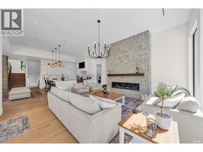 West Vancouver apartment for rent - A modern living room with a fireplace and a large couch.