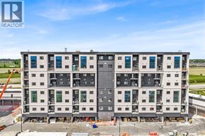 Lasalle condo for rent - A large, multi-story building under construction with a clear blue sky above.