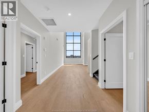 Lasalle condo for rent - A long hallway with a window at the end.