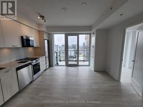 Hamilton (Corktown) condo for rent - A spacious kitchen with a view of the city.