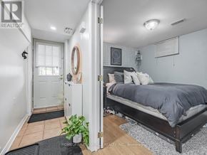 Toronto (East End-Danforth) apartment for rent - A bedroom with a bed, a dresser, and a mirror.