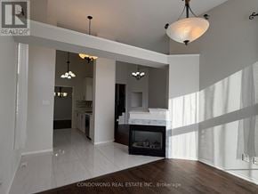 Richmond Hill (Rouge Woods) apartment for rent - A modern living room with a fireplace and a large window.
