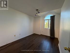 Richmond Hill (Rouge Woods) apartment for rent - A room with a window and a door.