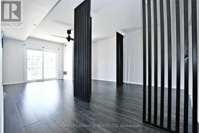 Barrie (Ardagh) condo for rent - A room with a black floor and a black column.