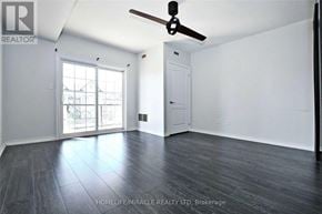 Barrie (Ardagh) condo for rent - A room with a ceiling fan and sliding glass doors.