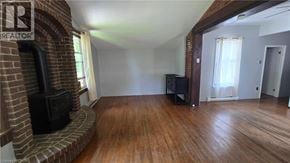 Listowel apartment for rent - A living room with a fireplace and a flat screen TV.