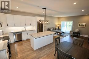 Seaforth townhouse for rent - A modern kitchen with a dining table and chairs.