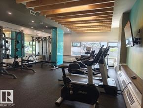 Edmonton apartment for rent - A gym with treadmills, weights, and exercise equipment.