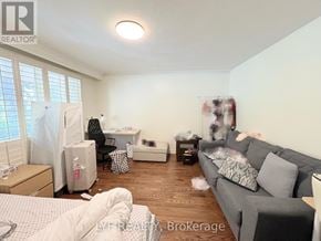 Markham (Unionville) apartment for rent - A room with a grey couch, a bed, and a desk with a computer.