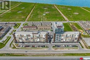 Grimsby (Grimsby Beach) condo for rent - A bird's eye view of a residential complex with a parking lot in front.
