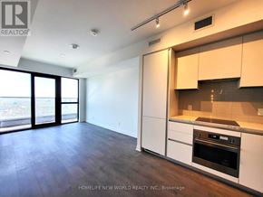 Mississauga (City Centre) condo for rent - A kitchen with white cabinets and a black oven.