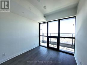 Mississauga (City Centre) condo for rent - A room with a sliding glass door leading to a balcony.