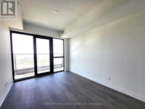Mississauga (City Centre) condo for rent - A room with a sliding glass door leading to a balcony.