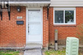 Ottawa townhouse for rent - A red brick house with a white door and a mailbox with the number 1468B.