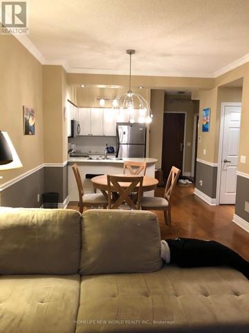 Toronto (Bay Street Corridor) condo for rent - A well-lit dining area with a table set for four.