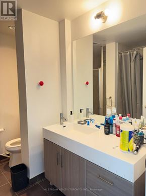 Toronto (Thorncliffe Park) condo for rent - A bathroom with a white counter top and a mirror above it.