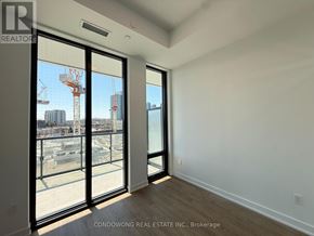 Toronto (Bayview Village) condo for rent - A room with a view of a construction site through the windows.