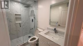 Vaughan (Patterson) apartment for rent - A bathroom with a toilet, sink, and shower.