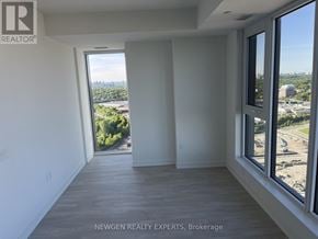 Toronto (Banbury-Don Mills) condo for rent - A room with a view of a cityscape through large windows.