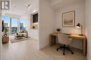 Toronto (Church-Yonge Corridor) condo for rent - A well-lit room with a desk and a chair.