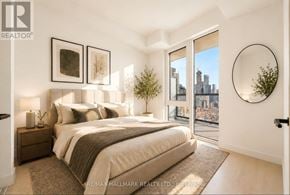 Toronto (Church-Yonge Corridor) condo for rent - A bedroom with a large bed and a view of the city.