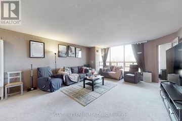 Brampton (Brampton South) condo for rent - A living room with a grey sofa set and a coffee table.