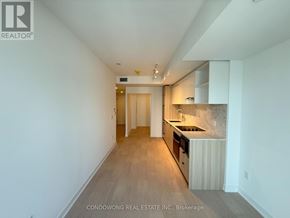 Toronto (Church-Yonge Corridor) condo for rent - A kitchen area with a sink, countertop, and cabinets.