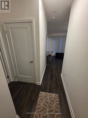 Toronto (Church-Yonge Corridor) condo for rent - A hallway with a white door and a rug on the floor.