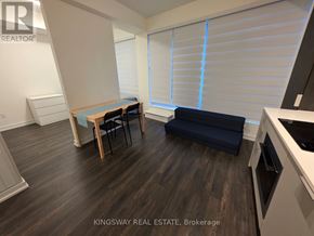 Toronto (Church-Yonge Corridor) condo for rent - A kitchen area with a table and chairs in a Kingsway Real Estate Brokerage.