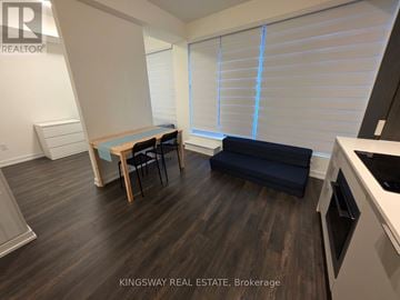 Toronto (Church-Yonge Corridor) condo for rent - A kitchen area with a table and chairs in a Kingsway Real Estate Brokerage.