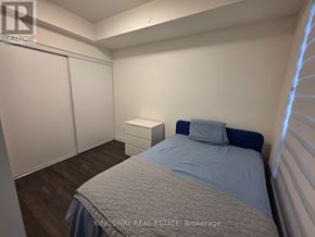Toronto (Church-Yonge Corridor) condo for rent - A bedroom with a bed, nightstand, and wardrobe.