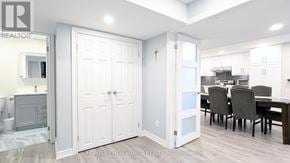 Whitchurch-Stouffville (Stouffville) apartment for rent - A white door is open to a kitchen area.