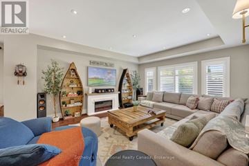Collingwood apartment for rent - A living room with a blue couch and a wooden coffee table.