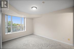 Toronto (Lawrence Park South) condo for rent - A room with a large window and carpeted floor.