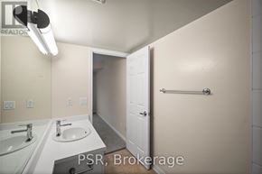 Toronto (Lawrence Park South) condo for rent - A bathroom with a sink, mirror, and towel bar.