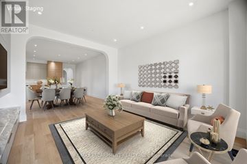 Mississauga (Port Credit) apartment for rent - A modern living room with a wooden coffee table and a grey sofa.