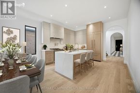 Mississauga (Port Credit) apartment for rent - A modern kitchen with a dining table set for four.