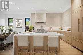 Mississauga (Port Credit) apartment for rent - A modern kitchen with a dining table and chairs.