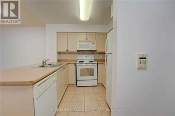 Toronto (Waterfront Communities) condo for rent - A kitchen with a white oven and sink.