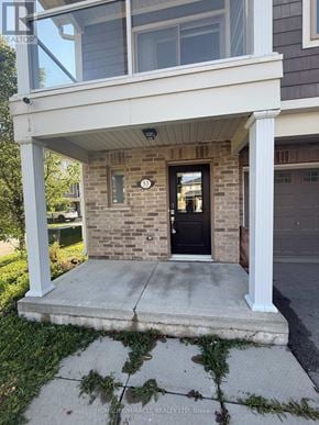 St. Catharines (Secord Woods) townhouse for rent - A house with a black door and a window is shown.