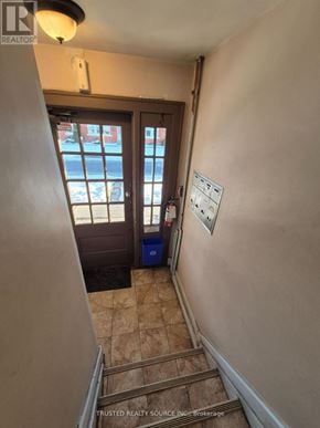 Windsor multi-family for rent - A hallway with a brown door and a white wall.