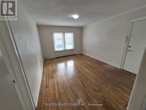 Windsor multi-family for rent - A room with wooden flooring and a window.