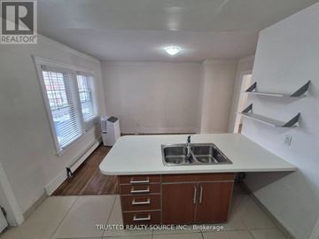 Windsor multi-family for rent - A kitchen with a sink and a window.