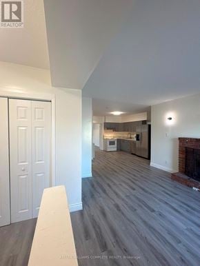 Niagara Falls (Cherrywood) multi-family for rent - A room with a fireplace and a dining table.