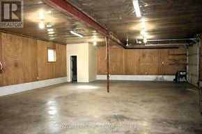Shelburne apartment for rent - A large empty room with a door and a window.