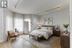 Toronto (Palmerston-Little Italy) multi-family for rent - A bedroom with a bed, nightstand, chair, and window.