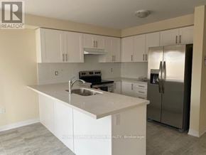 Kawartha Lakes (Lindsay) apartment for rent - A kitchen with white cabinets and stainless steel appliances.