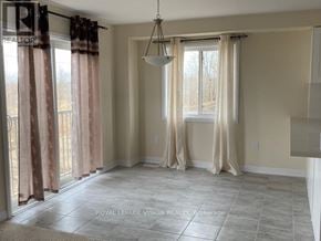 Kawartha Lakes (Lindsay) apartment for rent - A room with a large window and curtains.